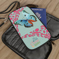 Mint passport wallet with zipper, butterfly and pink pattern, holds a blue passport