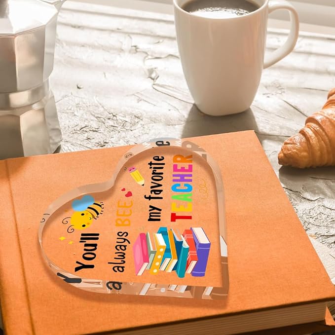 Acrylic heart teacher gift with bee, books, and 'my favorite TEACHER' text on card.