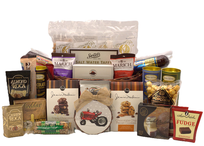 Christmas gift basket with assorted chocolates, cookies, popcorn, and crackers