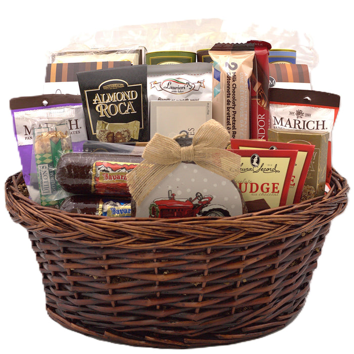 Wicker gift basket filled with assorted chocolates, cookies, popcorn, and candies