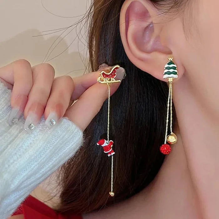 Gold-tone Christmas drop earrings with tree stud and Santa figure dangle