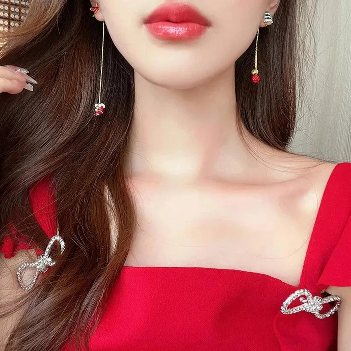 Christmas drop earrings with red and green charm drops on long silver chain dangles.