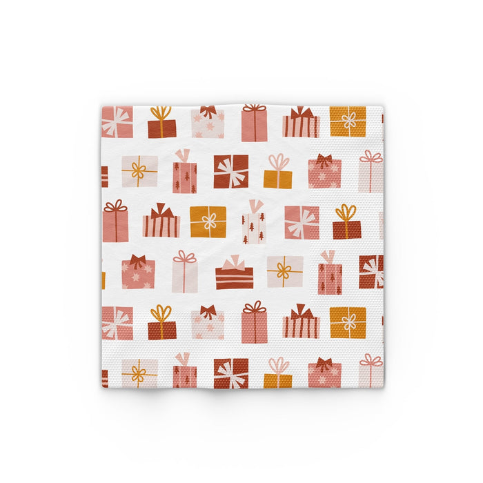 Christmas present icon paper napkins, white with red, pink, and gold gift patterns
