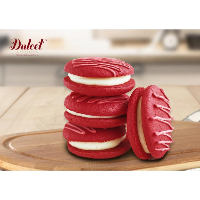 Stack of red velvet sandwich cookies with white filling
