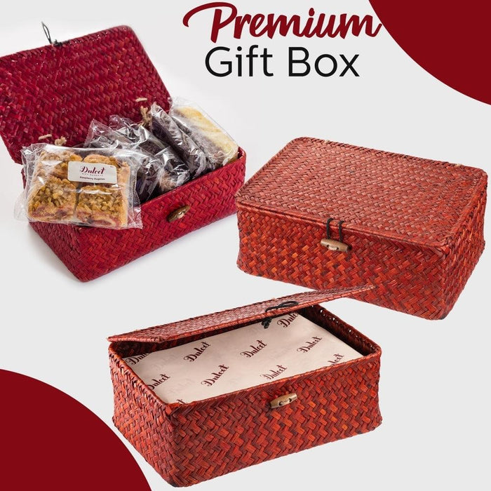 Red woven premium gift box with ribbon and wrapped cookie assortment inside