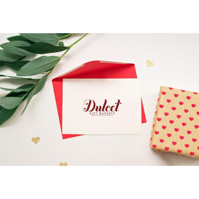Red-and-white gift box with gold hearts paper and a ribbon-tied chocolate box