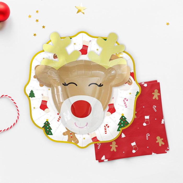 Christmas icon plate with gold scalloped rim, featuring a reindeer face and gingerbread characters