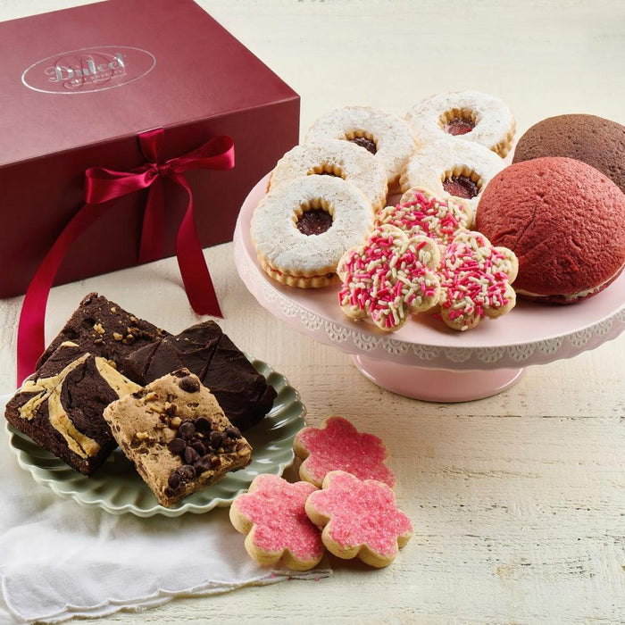 Mother’s Day gift assortment with cookies and brownies; red ribbon gift box