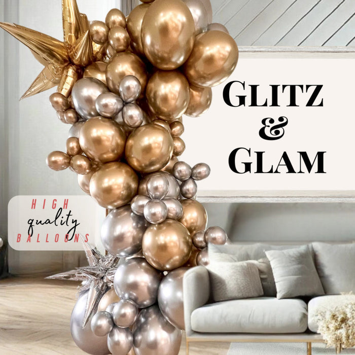 Silver, gold, and bronze balloon cluster arch with star toppers