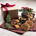 Holiday kraft gift box with ribbon, assorted cookies, and festive tree-shaped treats