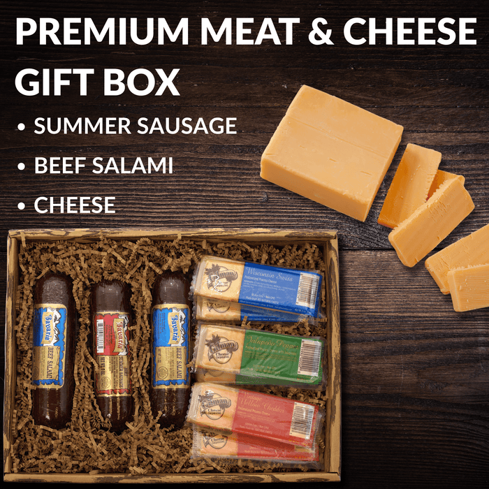 Meat and cheese gift box with listed contents and cheese blocks and salami