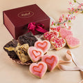 Valentines sweets gift basket with maroon box, ribbon, heart cookies and candies