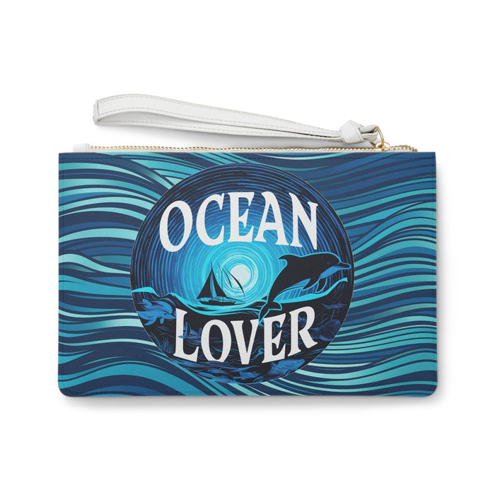 Blue printed clutch bag with white wrist strap and gold zipper, 'Ocean Lover' logo
