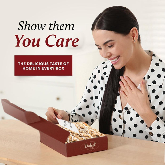 Sweets gift box being opened by a woman; Dulcet branding visible