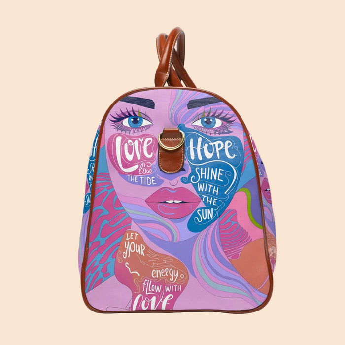 Purple art-print dome duffel with brown leather top handles and center clasp emblem