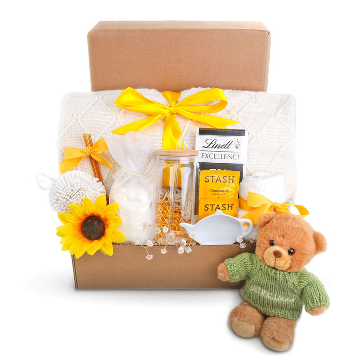Relaxation gift box with yellow ribbon, white tulle, chocolate jar, teddy plush