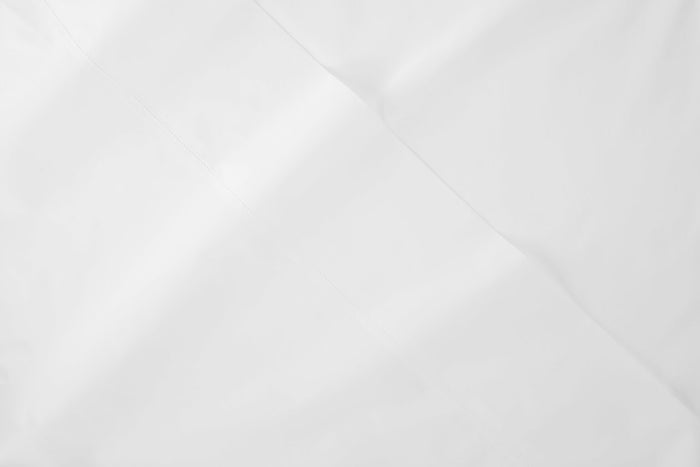 Close-up of the fabric of a Percale sheet, white