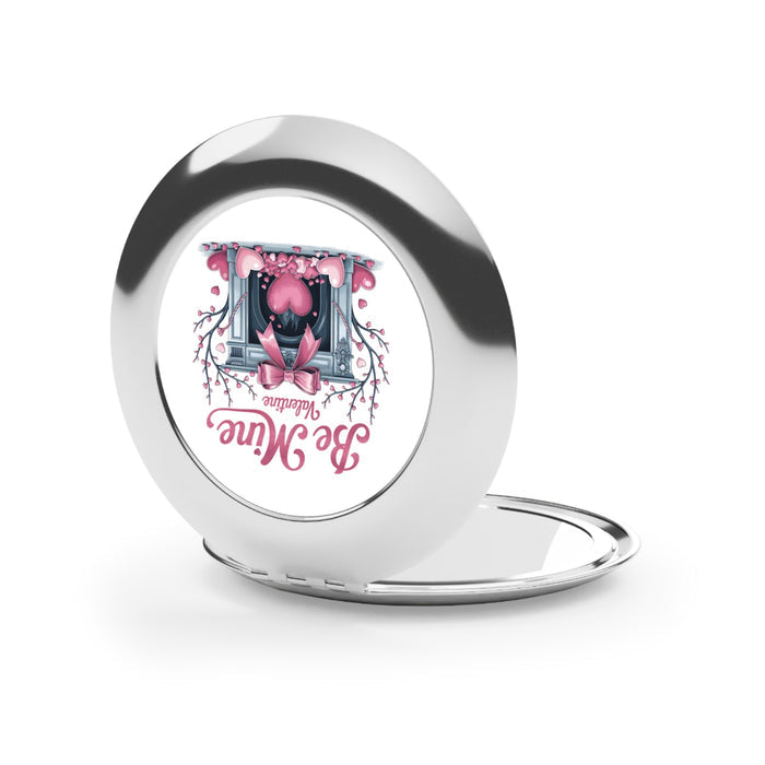 Silver glossy compact travel mirror open with round mirror panel and hinge