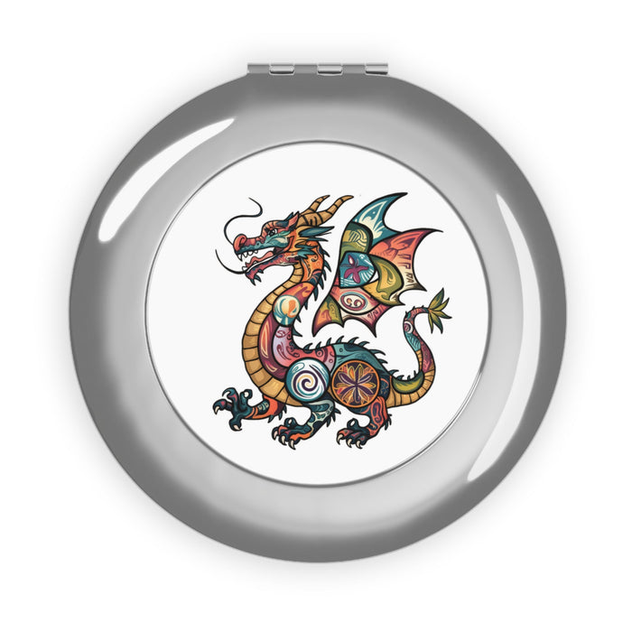 Silver glossy compact mirror with colorful dragon crest illustration in center