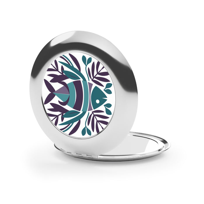 Compact travel mirror with silver glossy frame, fish life graphic, and open lid