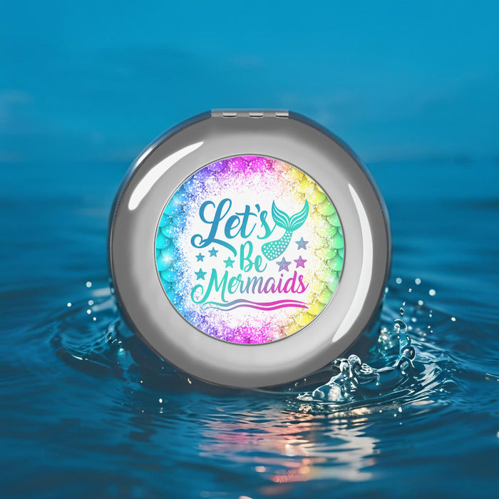 Silver glossy compact travel mirror with mermaid quote graphic, circular flip design