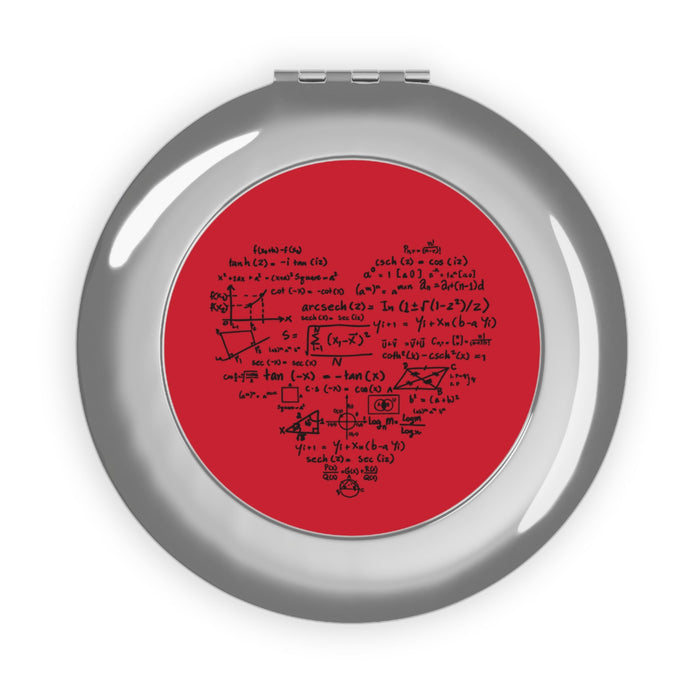 Silver glossy round compact travel mirror with red math-themed insert under glass rim