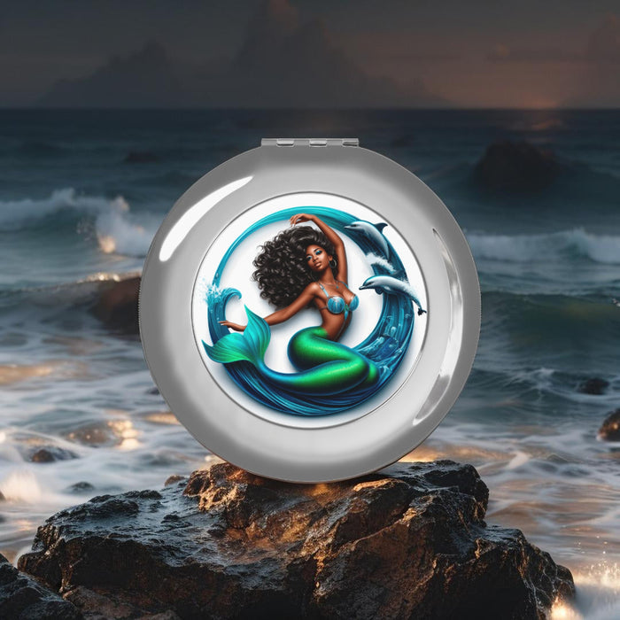 Silver glossy compact travel mirror with mermaid graphic, closed round design