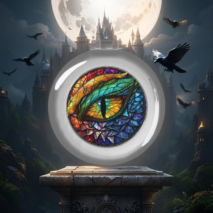 Compact travel mirror with dragon eye artwork, round silver lid open.