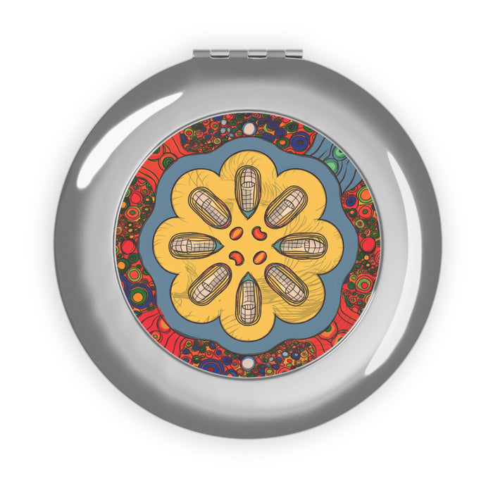 Silver glossy compact travel mirror with circular colorful floral pattern center