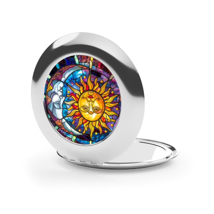 Round open compact mirror with glossy silver edge and sun-and-moon art