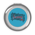 Compact travel mirror with silver glossy round case and blue word-collage center