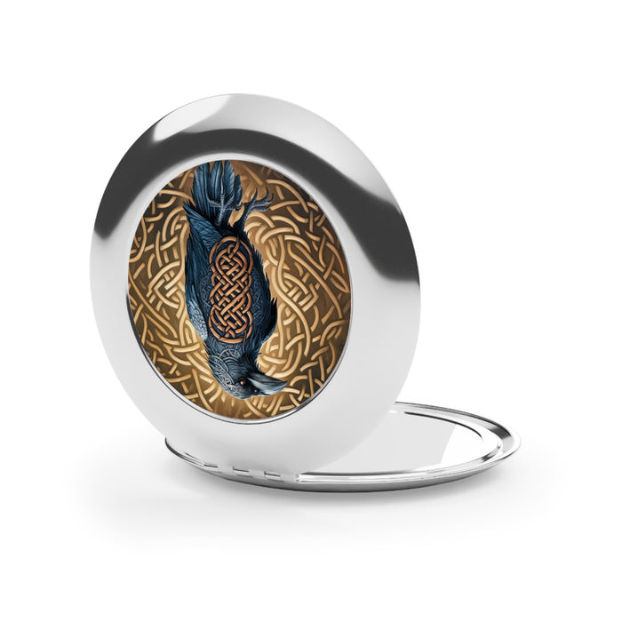 Silver glossy compact mirror open, featuring round bird and Celtic knot artwork