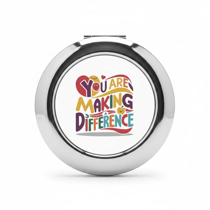 Silver glossy compact travel mirror with centered logo graphic on front
