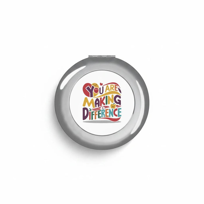 Silver glossy compact travel mirror with centered logo graphic on smooth front