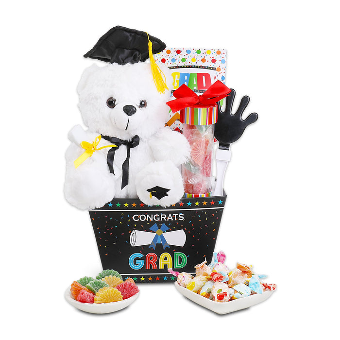 Graduation gift basket with white plush teddy, mortarboard, ribbon bow, and 'GRAD' basket