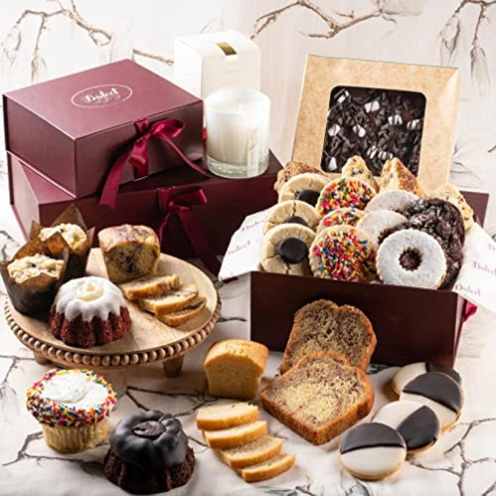 Assorted cookies and pastries in a gift box with ribbon accents