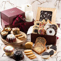 Assorted cookies and pastries in a gift box with ribbon accents