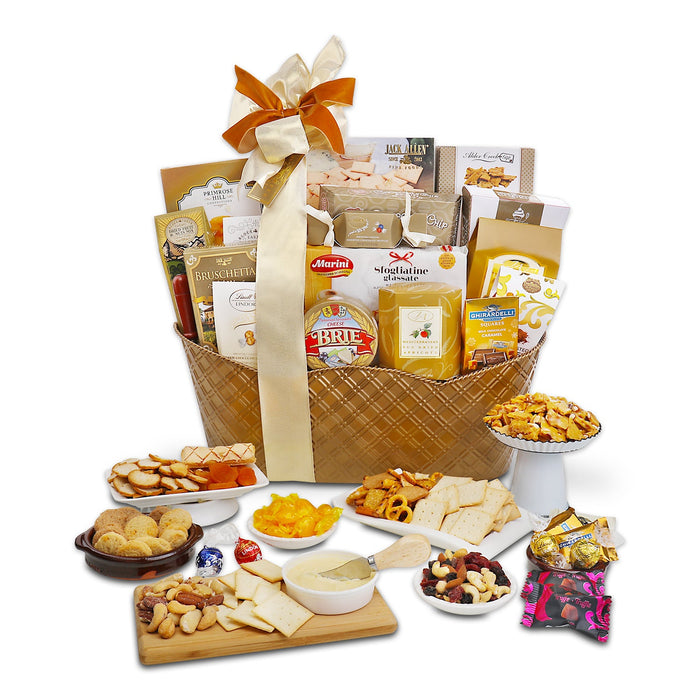 Wicker gift basket with gold ribbon, assorted snacks and cheese items arranged inside