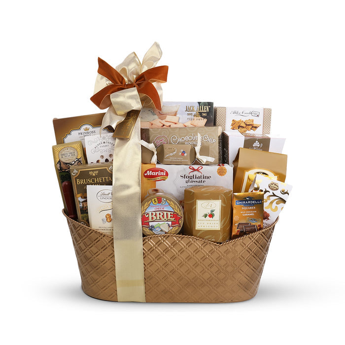 Wicker gift basket with cream ribbon bow, assorted sweet and savory gift contents