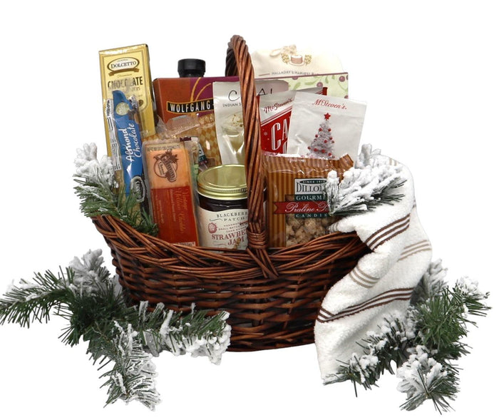 Large wicker gift basket with assorted Christmas breakfast treats, wrapped in striped cloth