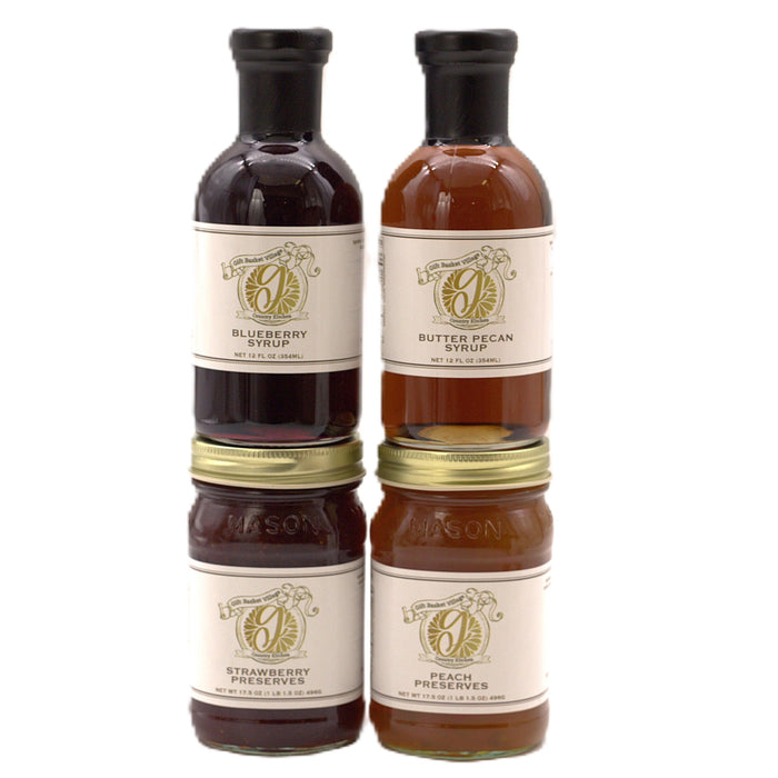 Set of four fruit syrup and preserve bottles with black caps and gold lids