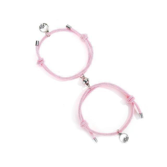Pink braided couple magnetic bracelets with heart and charm beads and metal ends