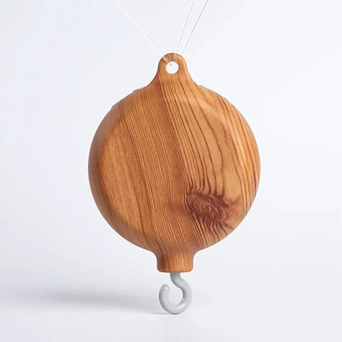 Wooden hanging whale music box toy with top loop and curved white hook
