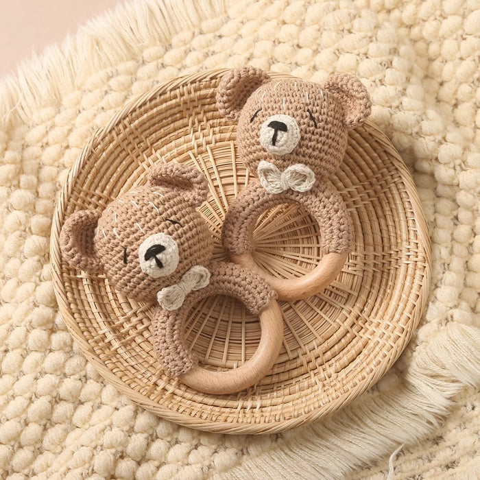 Crochet teddy bear teether with wooden ring and embroidered face, beige and brown