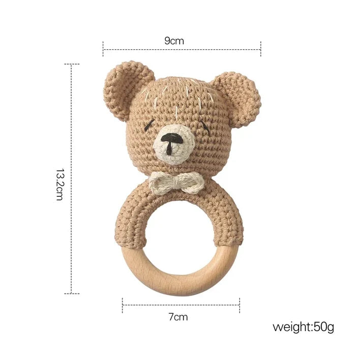 Crochet brown bear teether rattle with wooden ring and white bow detail