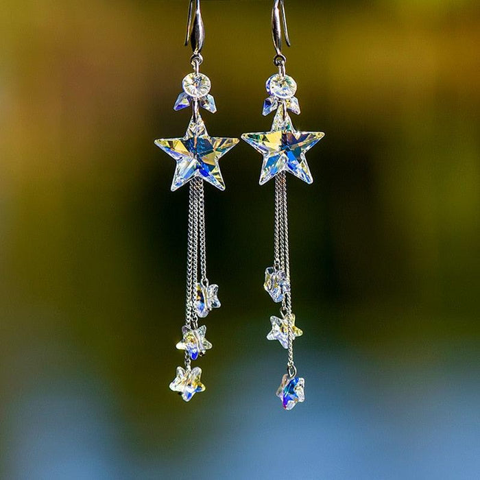 Star crystal dangling earrings with blue star drops and silver-tone chain tassels