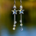 Star crystal dangling earrings with blue star drops and silver-tone chain tassels