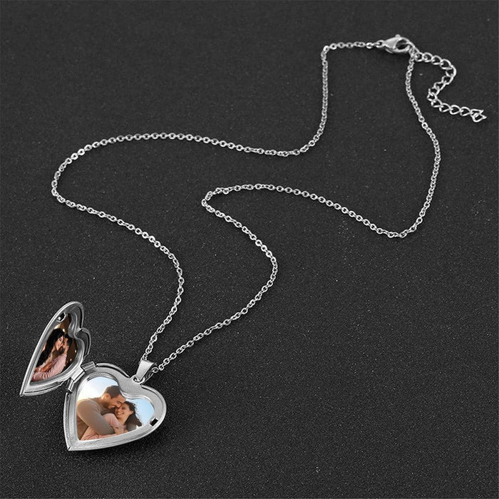 Two heart photo lockets on silver chains with heart-shaped photo windows