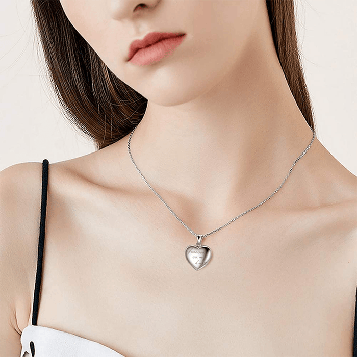 Silver heart photo locket necklace with small heart pendant on a chain