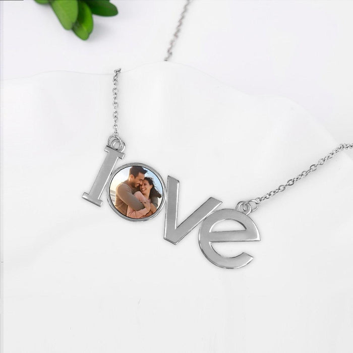 Silver LOVE pendant photo necklace with round photo disc between LOVE letters
